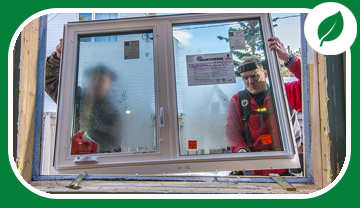 2 men installing a new window